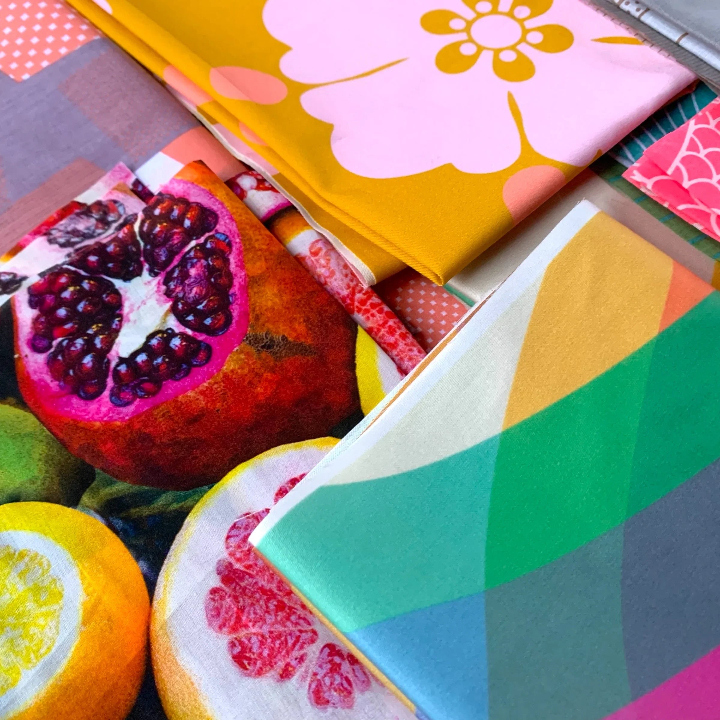 Colorful Hawaiian print fat quarters with floral, fruit, and geometric patterns