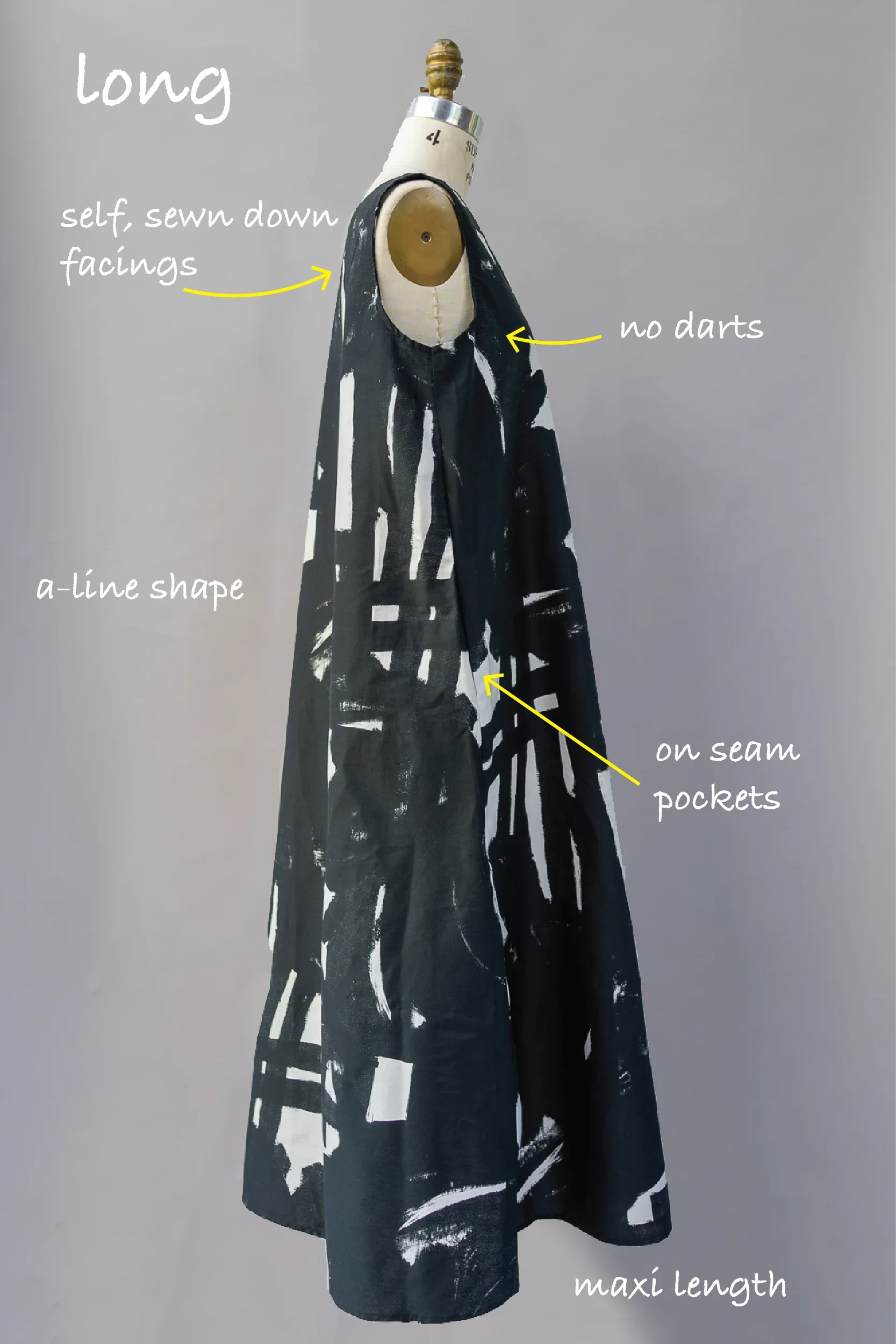 Long maxi A-line dress with abstract black and white print, sleeveless, on seam pockets