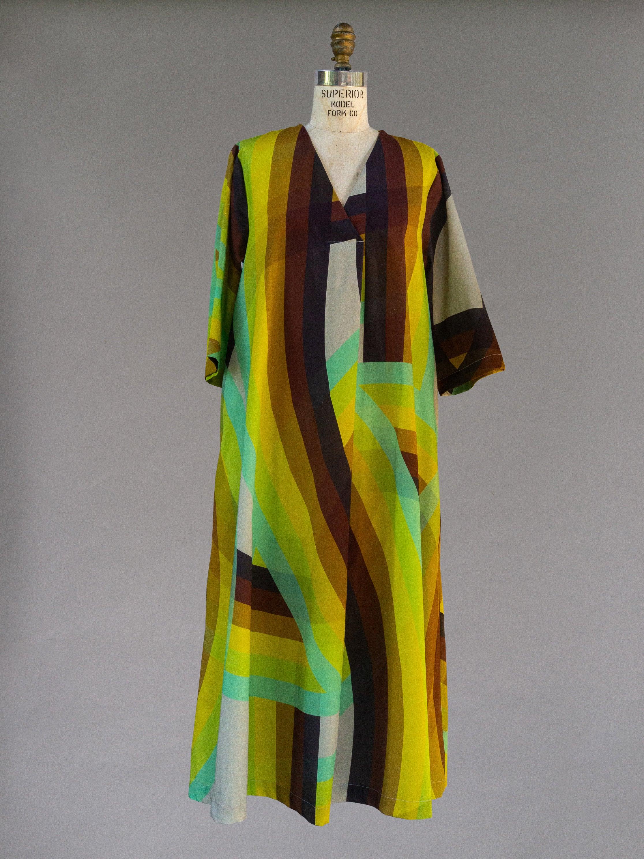 Colorful modern muumuu dress with bold rainbow stripes displayed on mannequin