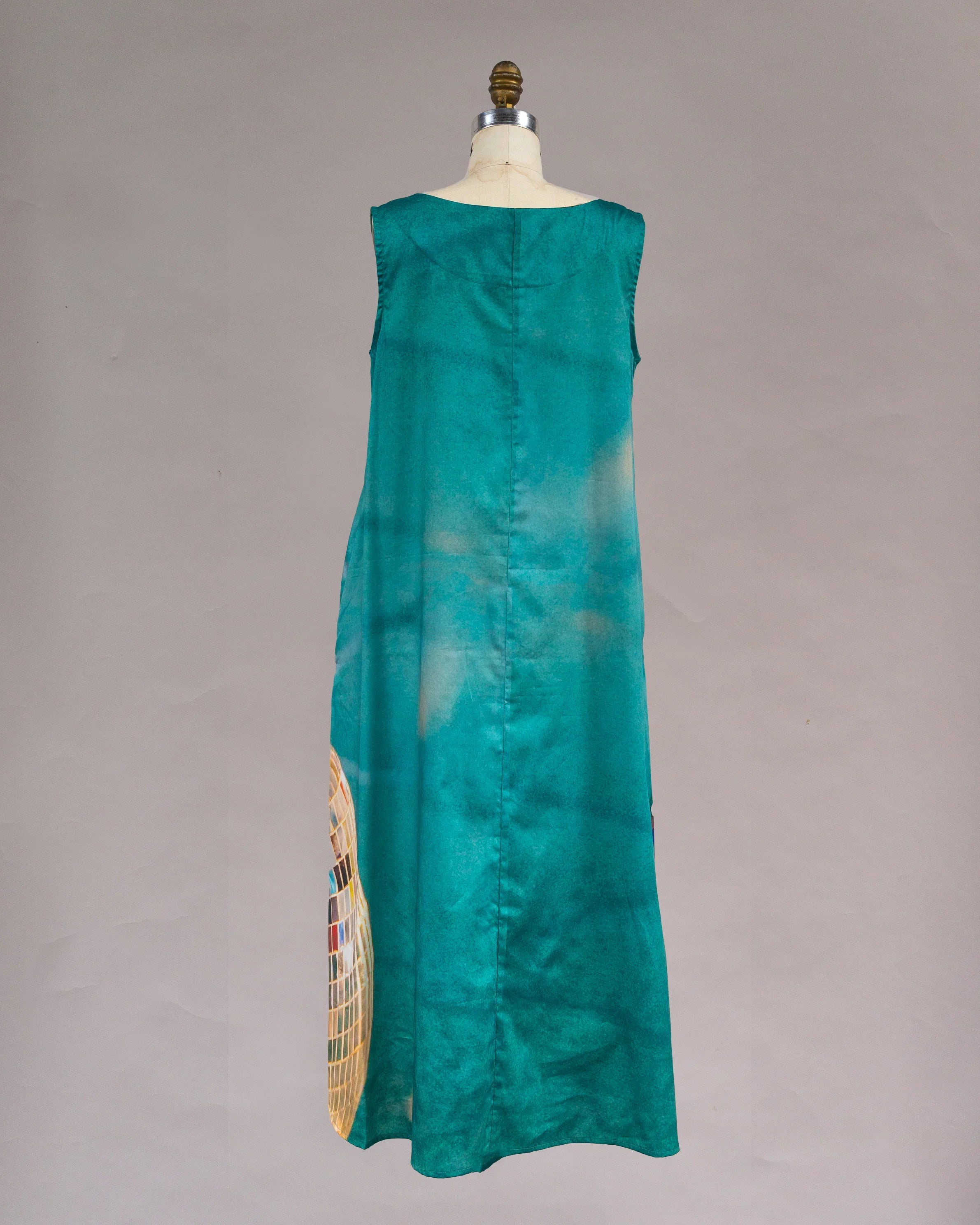 Teal sleeveless long muumuu dress with subtle disco ball print and modern Hawaiian style