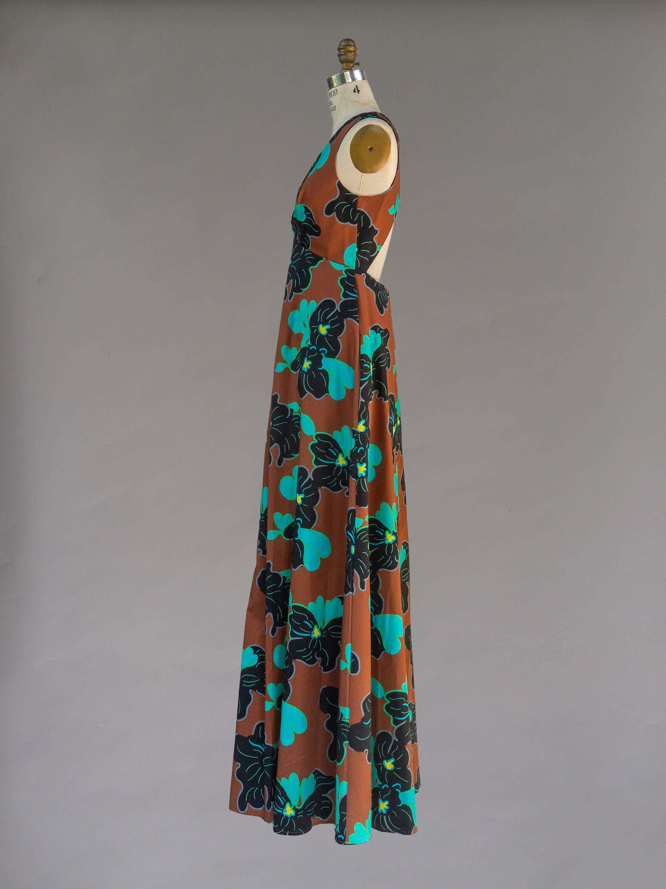 Origami Dress 1961 Chestnut, side view, featuring a floral pattern and open back design.