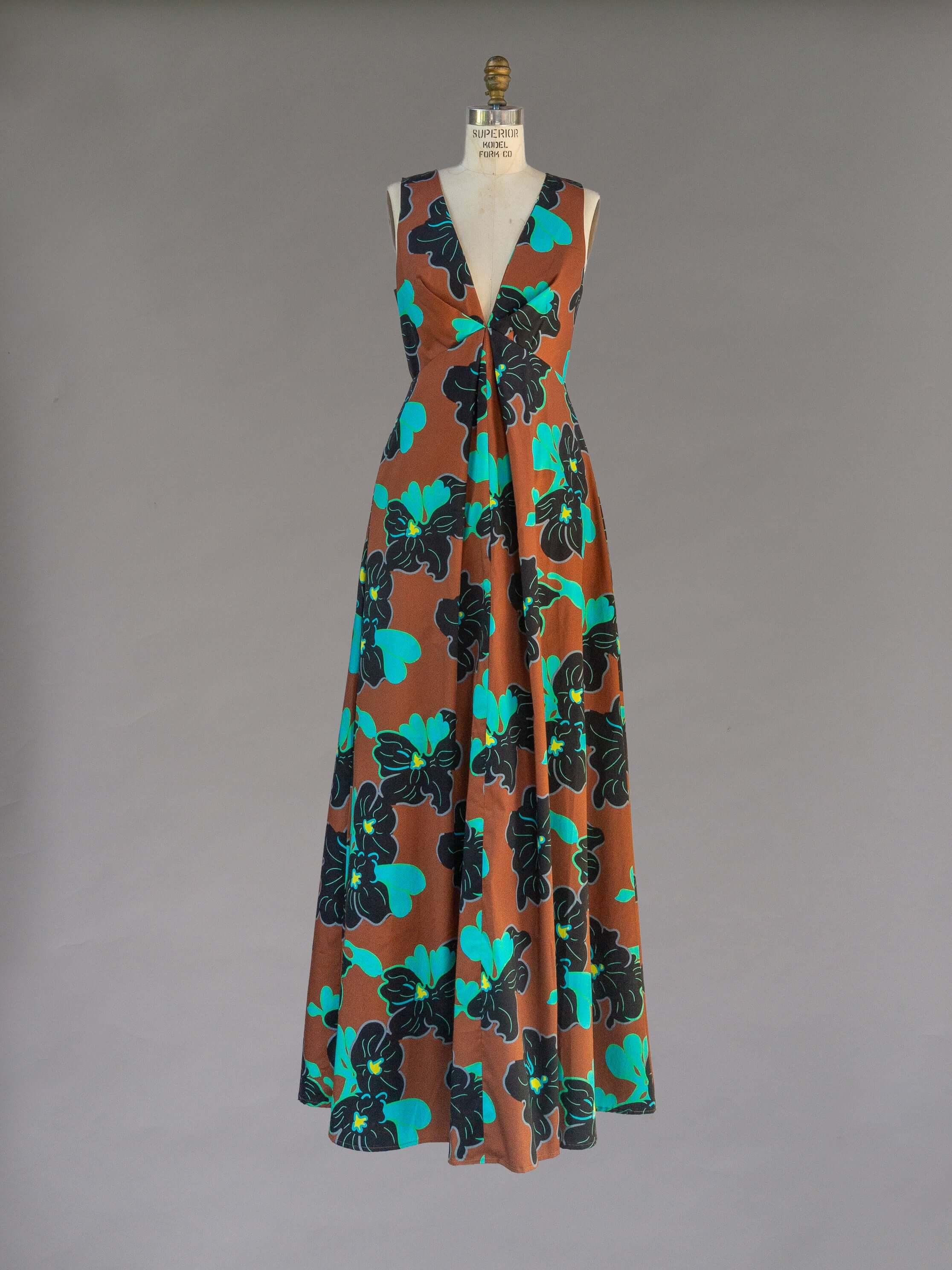 Origami Dress 1961 Chestnut with a deep plunge and open back, featuring a vintage 70s-inspired silhouette.