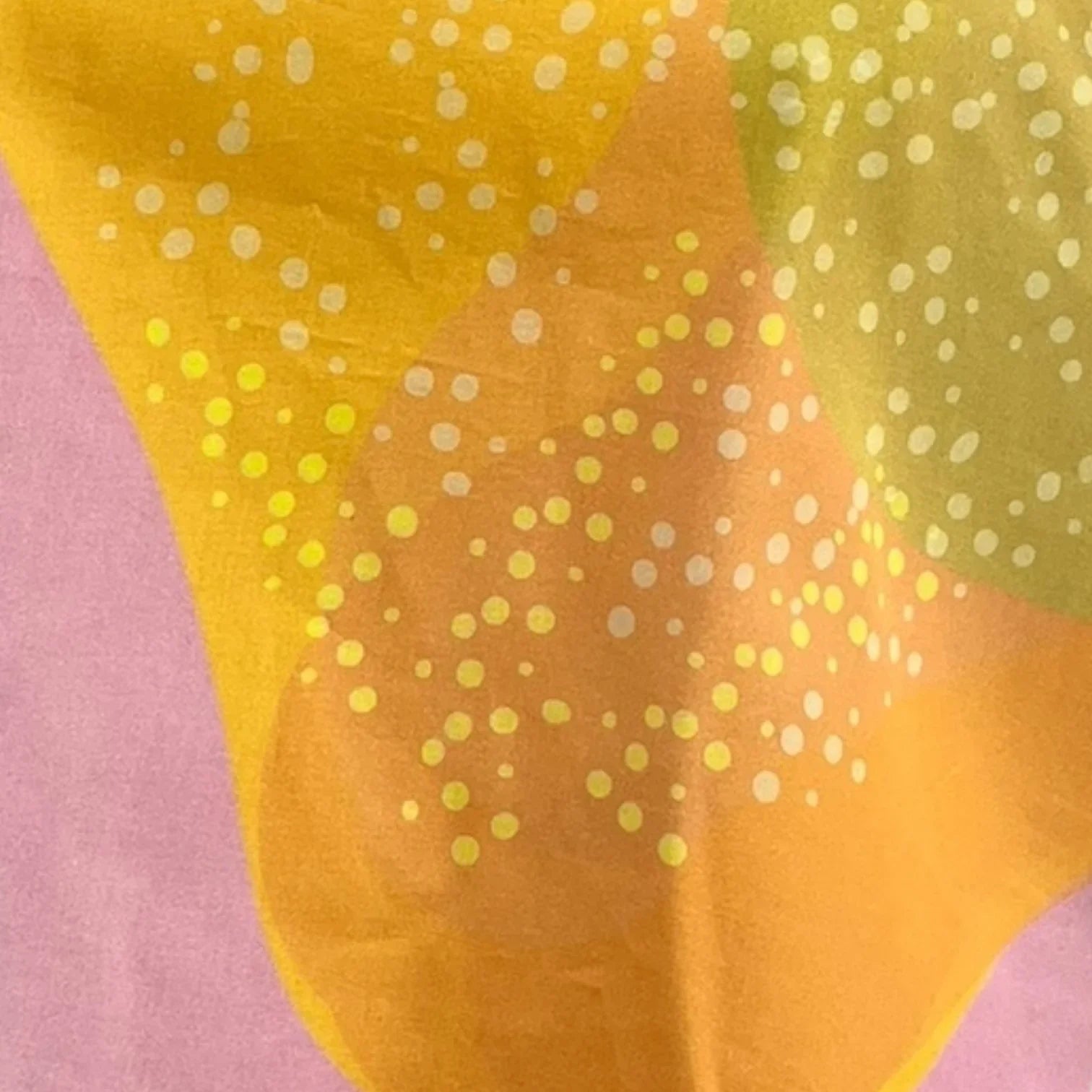Mango yellow and pastel pink Hawaiian fabric swatch with abstract dotted print