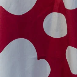 Red pareo fabric swatch with large white organic shapes, Hawaiian print textile