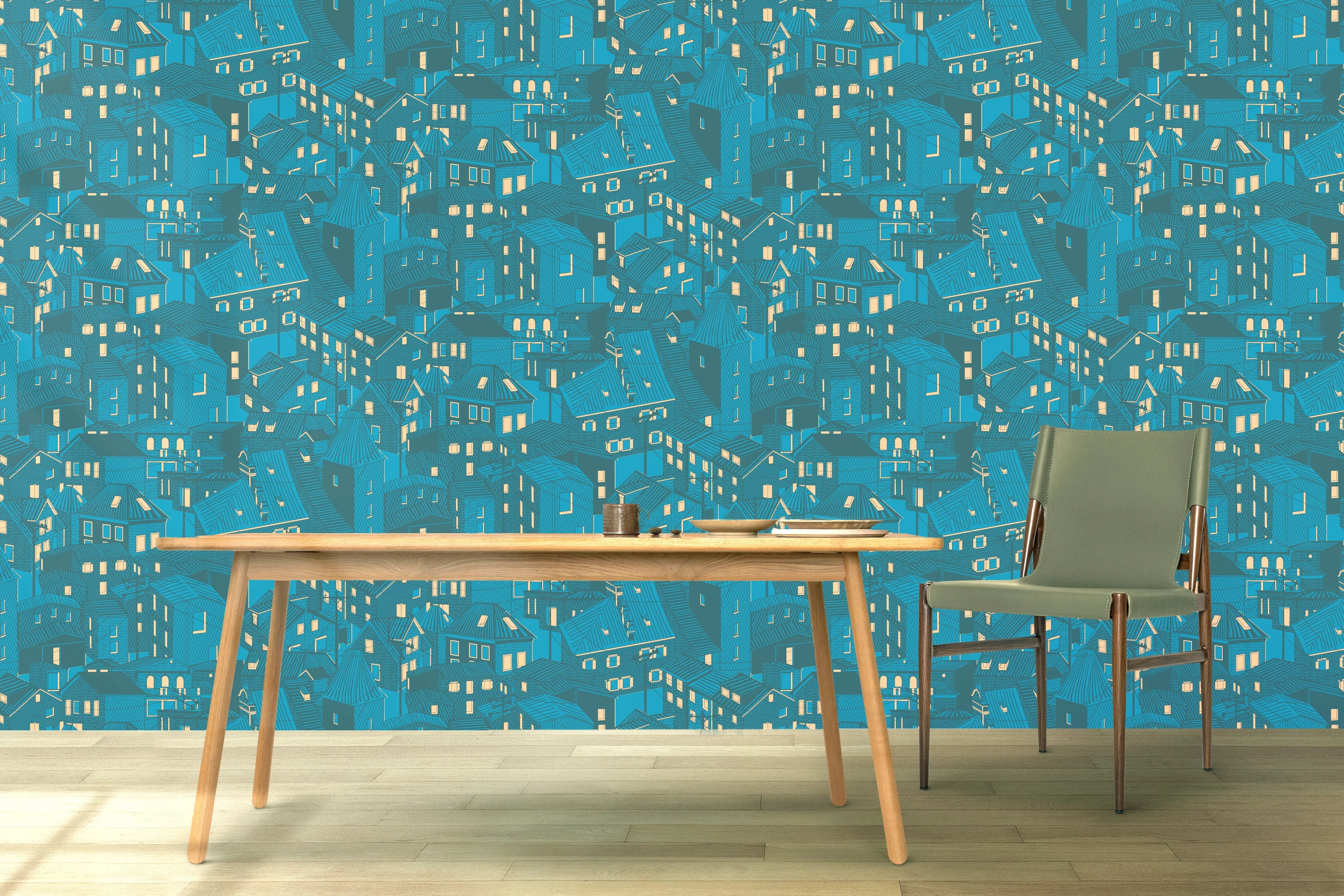 Modern blue wallpaper with abstract house pattern, wooden table and green chair