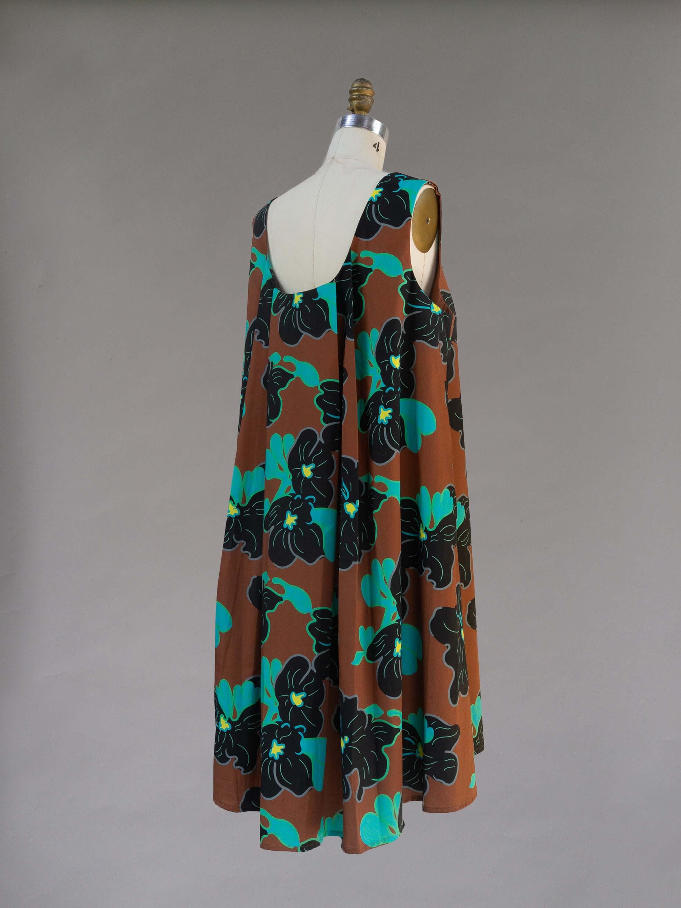 Watteau Dress 1961 Chestnut back view showcasing iconic pleating and floral print on a knee-length cotton dress.